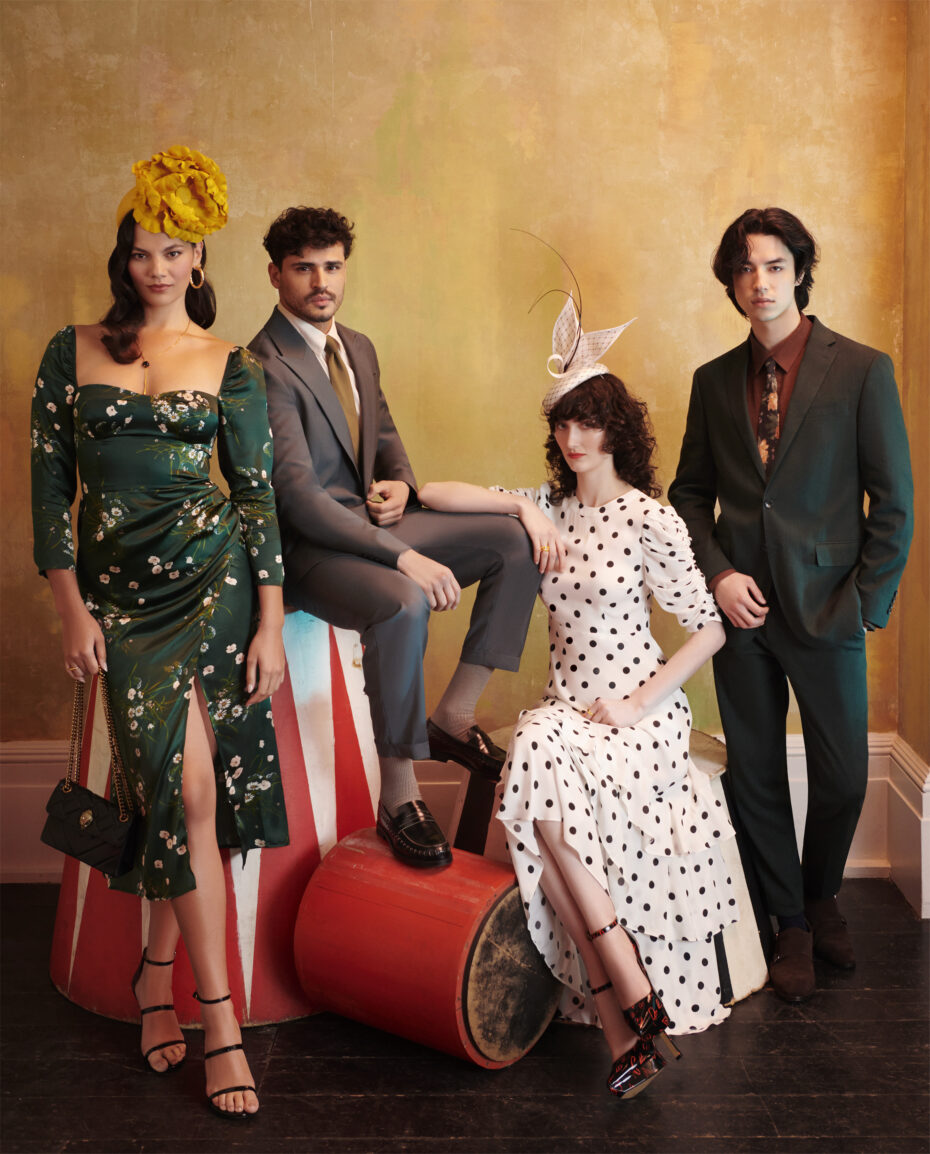 Four people in fashionable clothes posing for the 2023 Royal Ascot marketing campaign